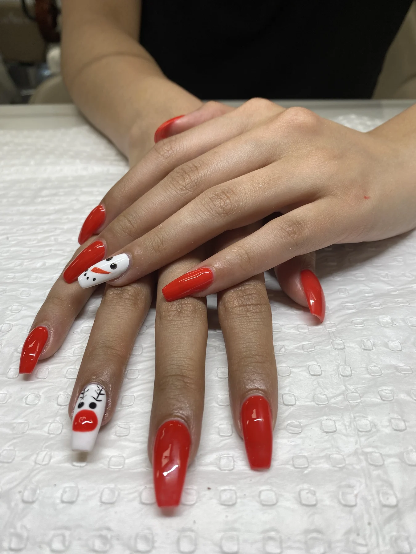 Long scarlet nails with hand-painted character accent art