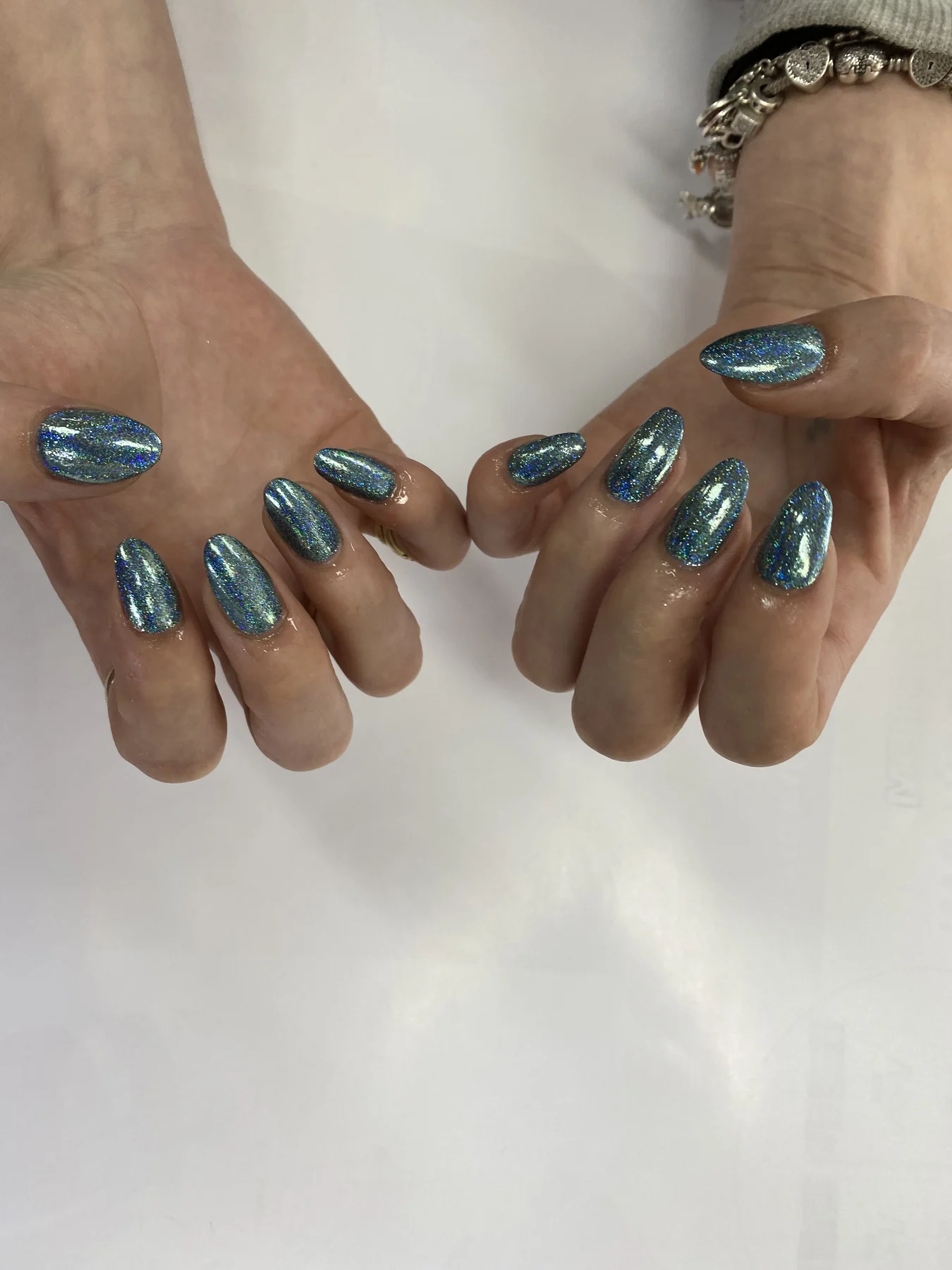 Blue-teal glitter almond nails