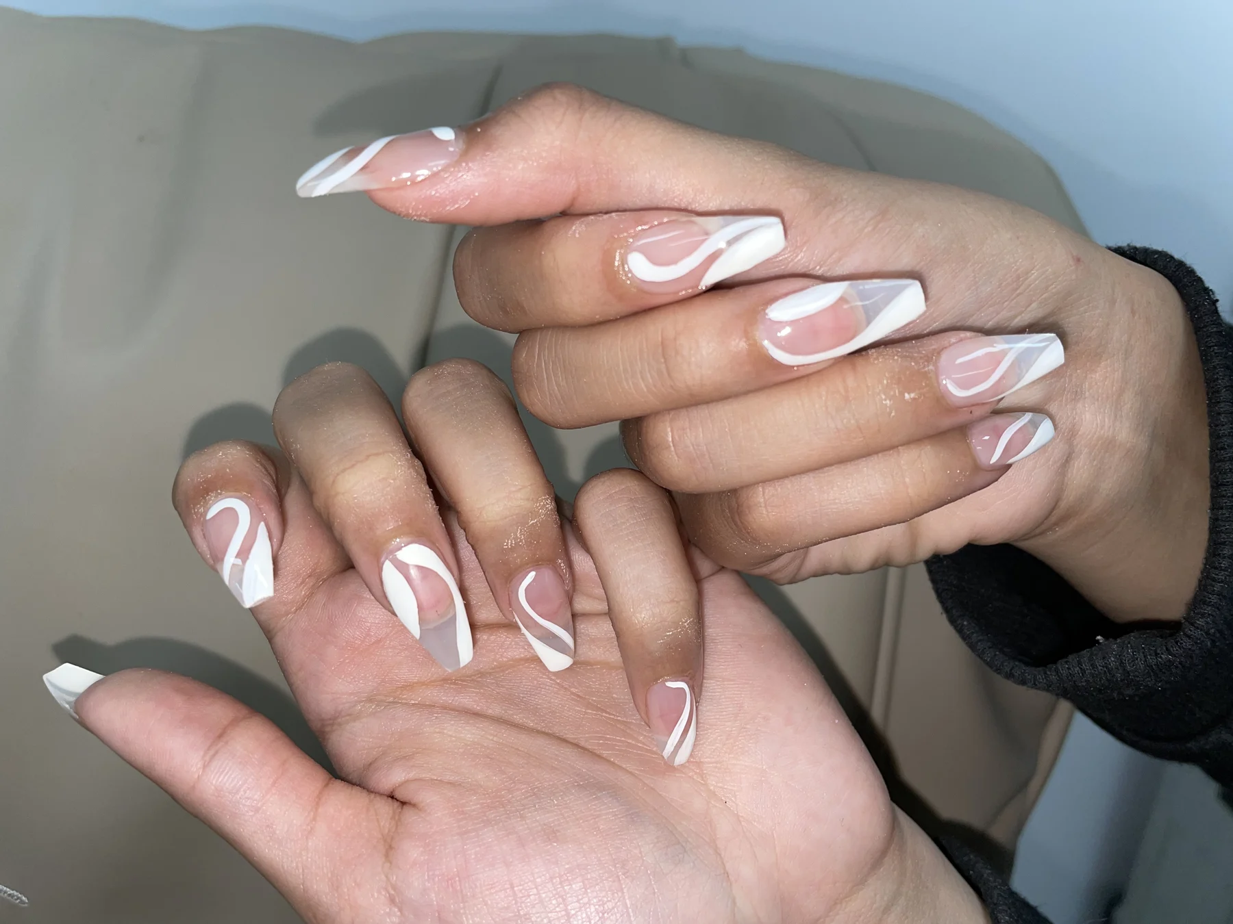 White swirl french nails — two hands