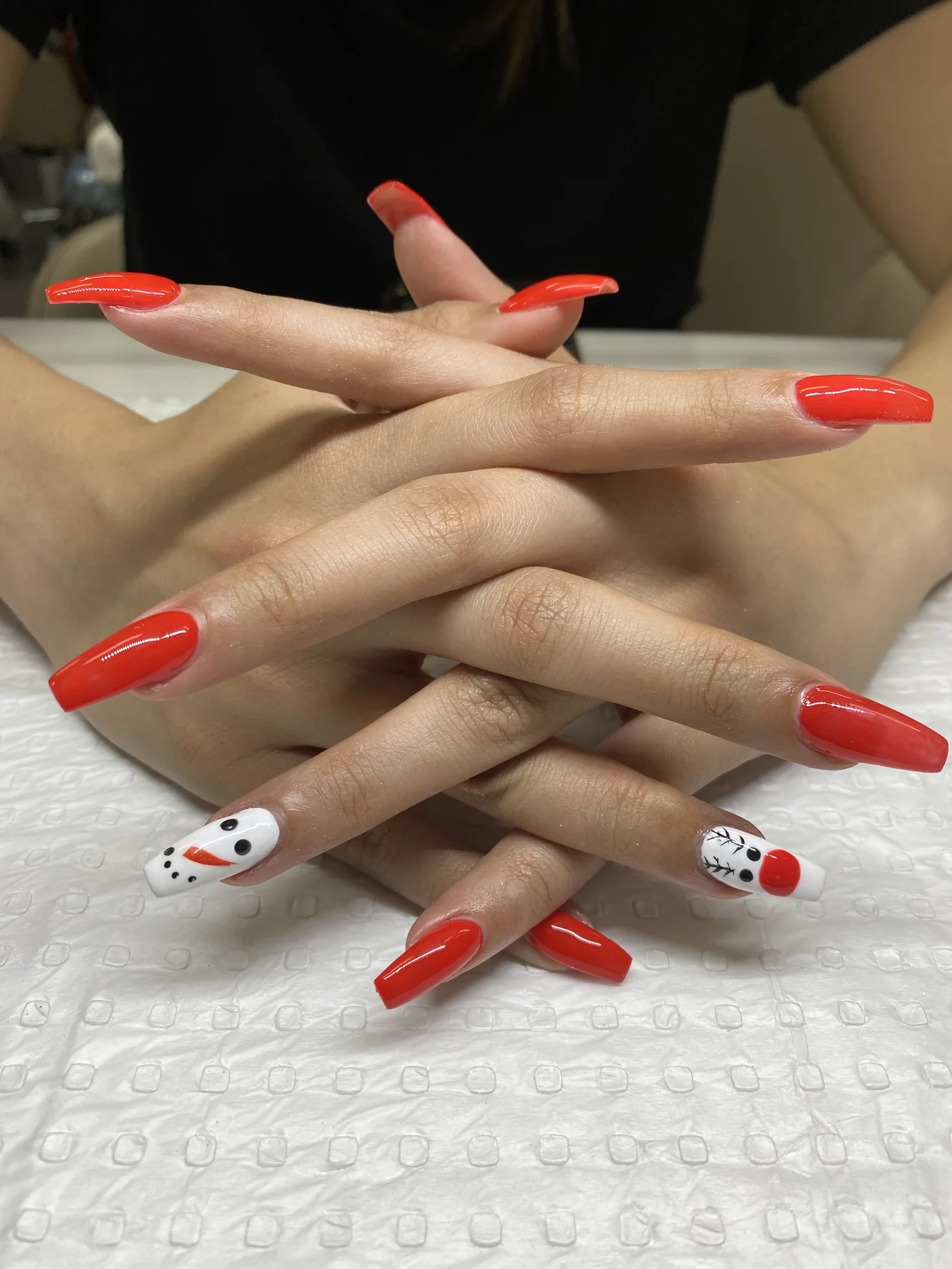 Long scarlet nails with hand-painted snowman accent art